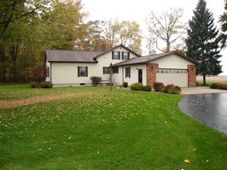 Country home with asphalt drive on nearly 12 acres with woods and outbuildings.  1-1/2 Story remodeled farm home with 3 bedrooms, 2 baths, eat-in kitchen w/custom hickory cabinets (J. Miller) and all appliances including washer and dryer.

Spacious living/dining room, full concrete block basement, covered front porch, rear deck and extra deep 2-car garage.

Quiet location convenient to town. - Country Home on 3.5 Acres